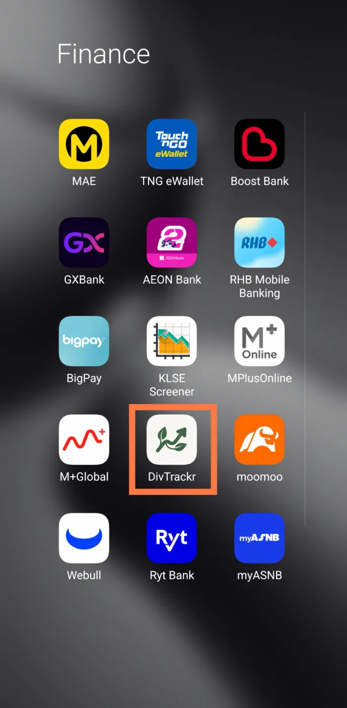 Phone home screen with the DivTrackr icon next to banking and broker apps